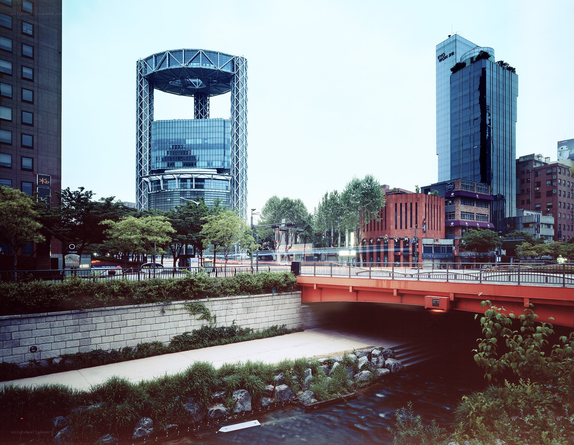 Modern cityscape with river and bridge