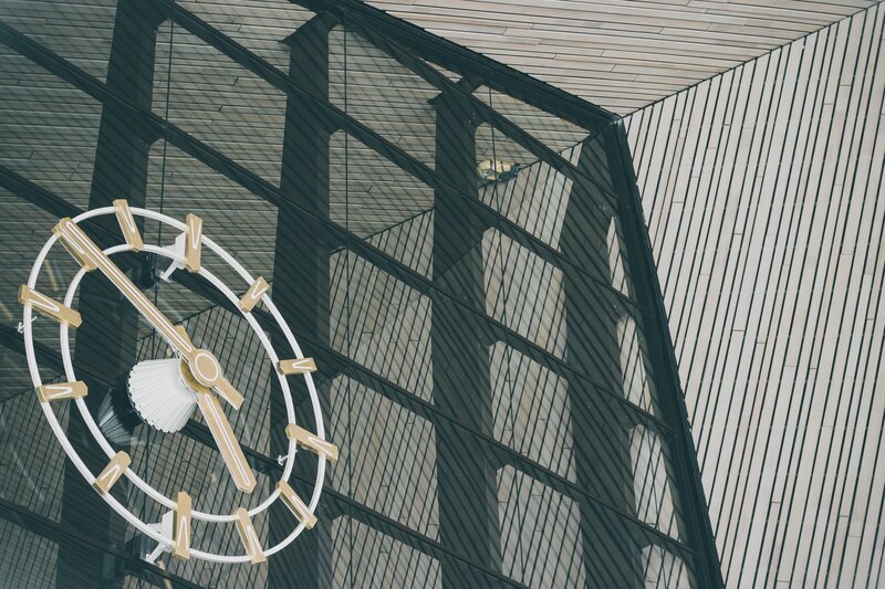Modern clock on glass facade