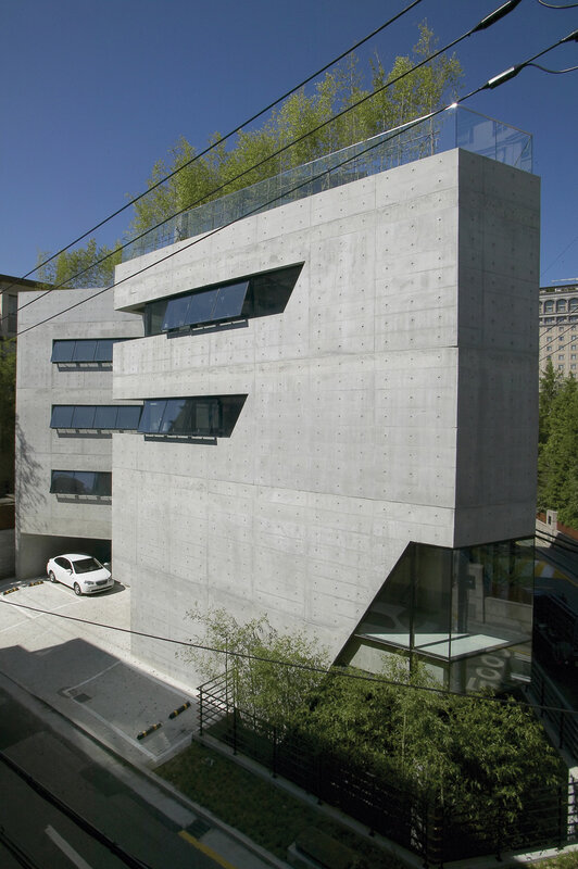 Modern concrete building with green roof
