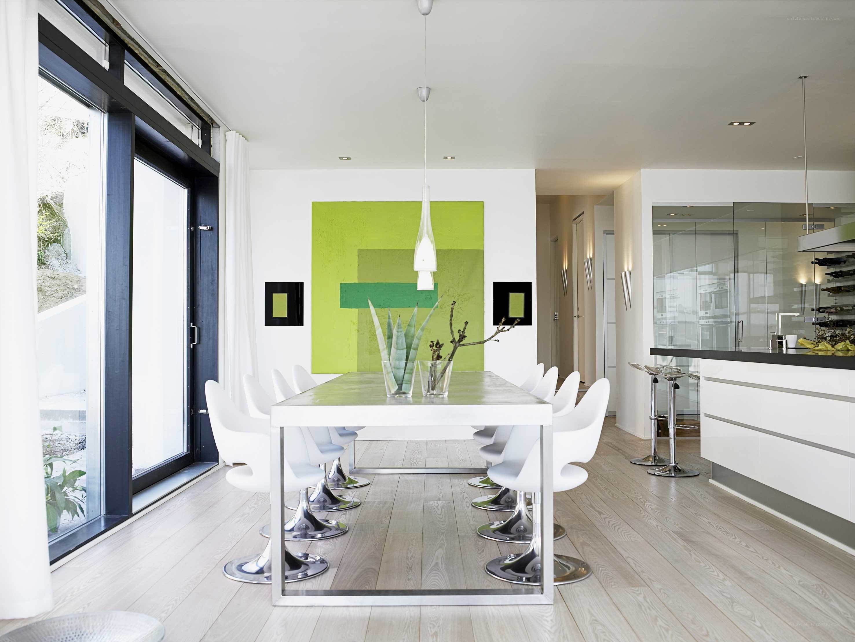 Modern dining room with green art