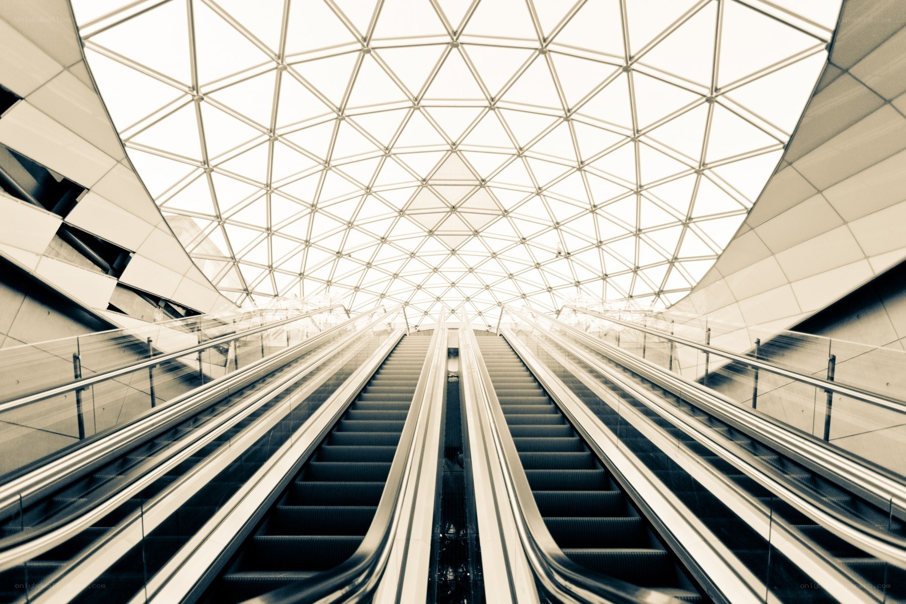 Modern escalators under glass dome