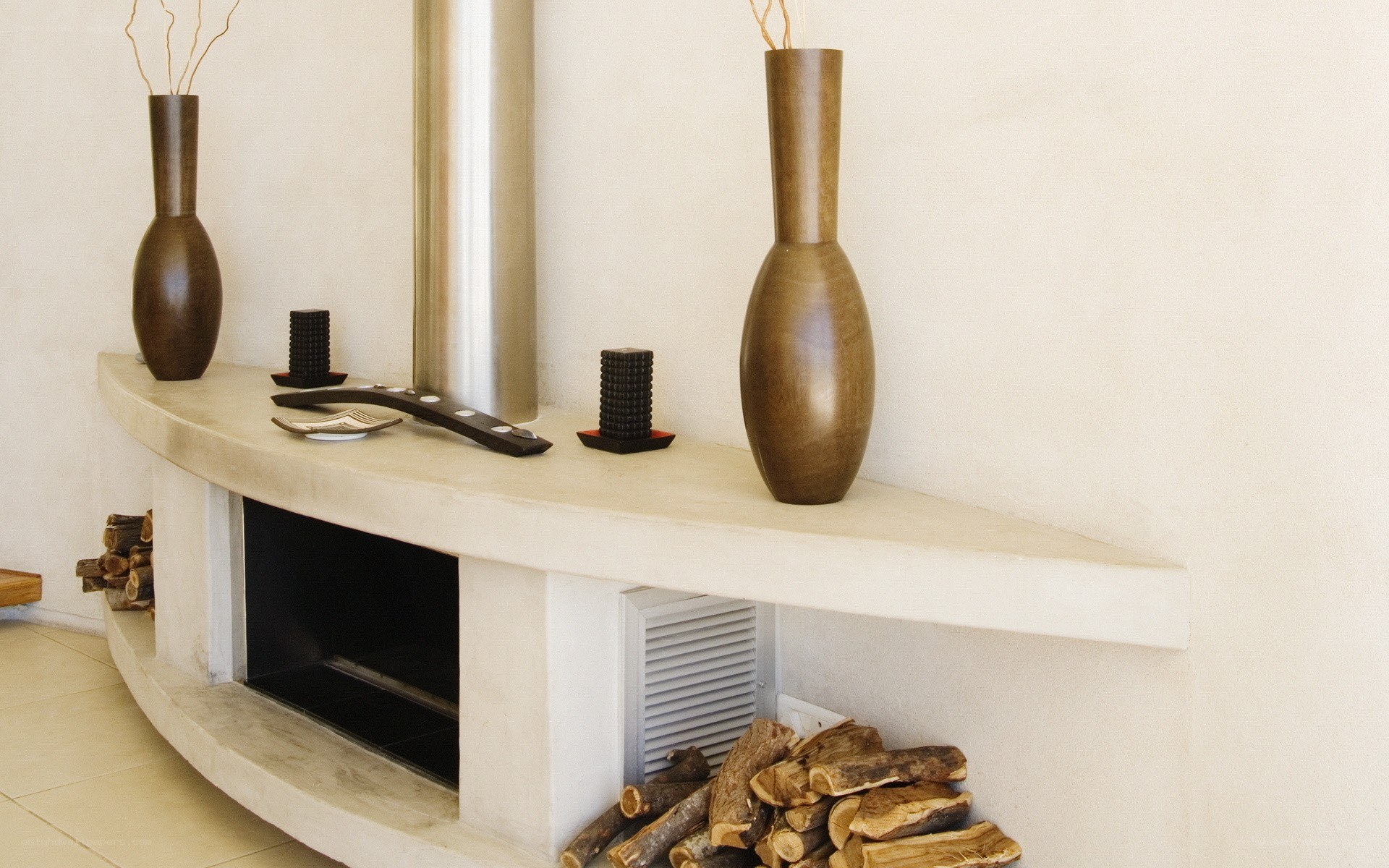 Modern fireplace with decorative vases