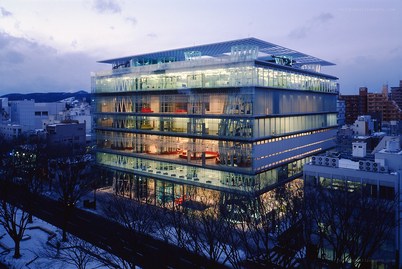 modern glass building at dusk