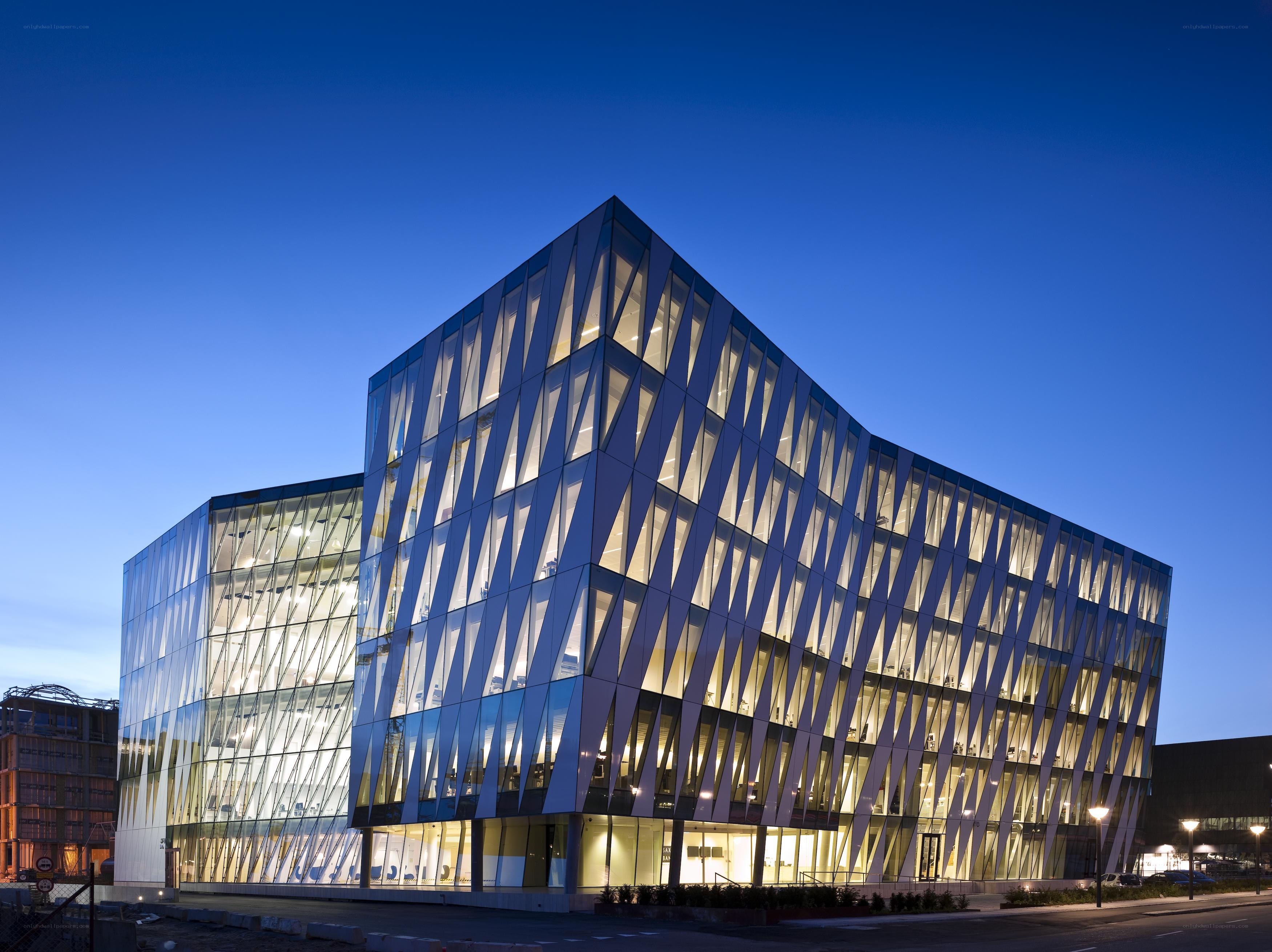 modern glass building at dusk