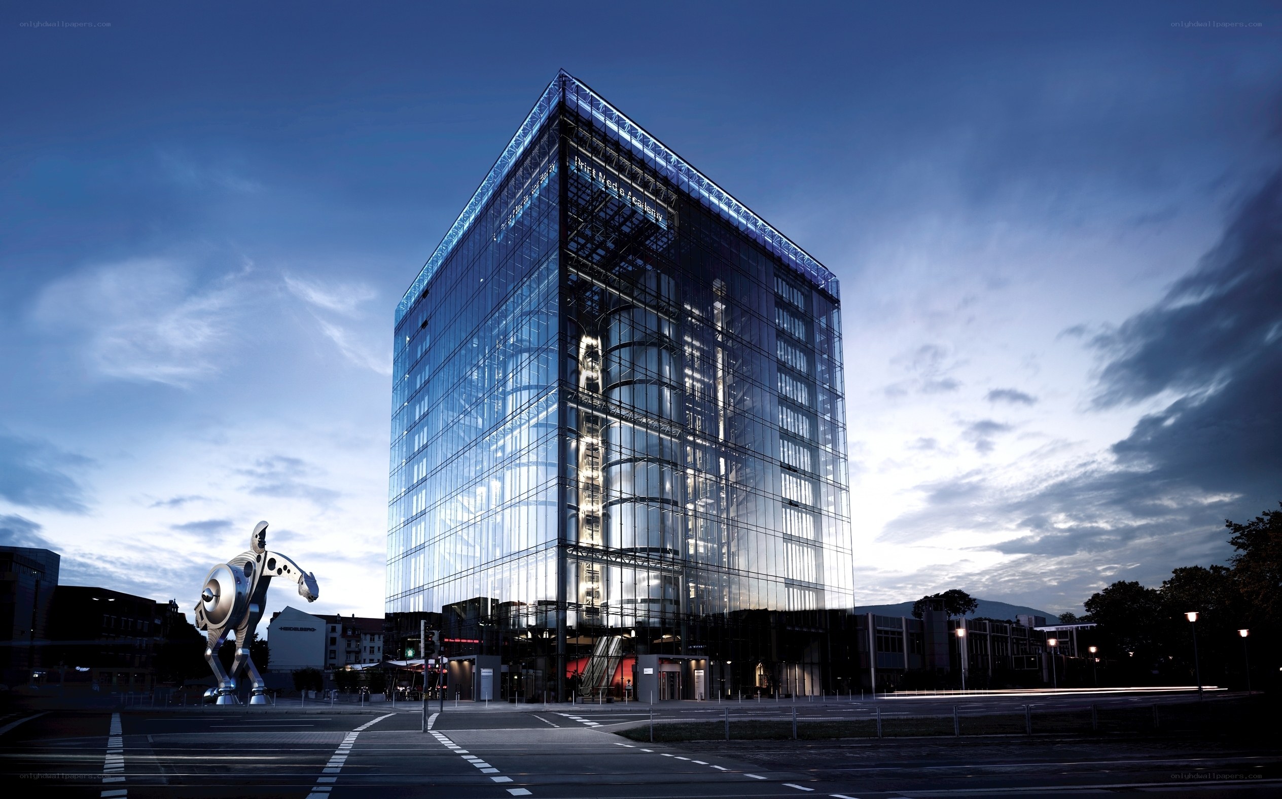 Modern glass building at dusk