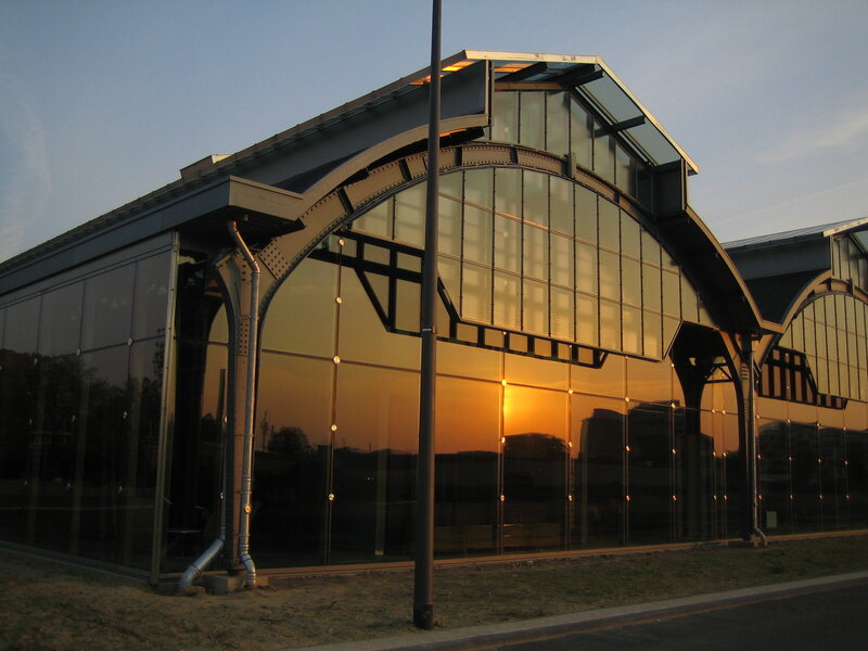 Modern glass building at sunset