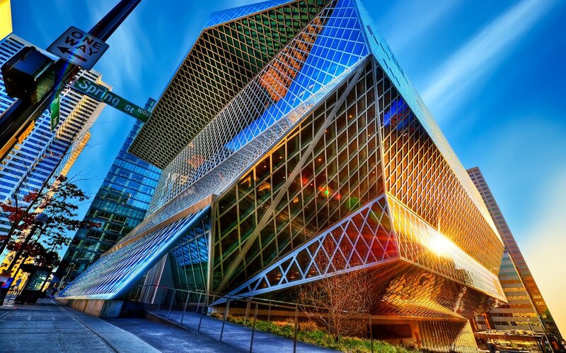 Modern glass building at sunset