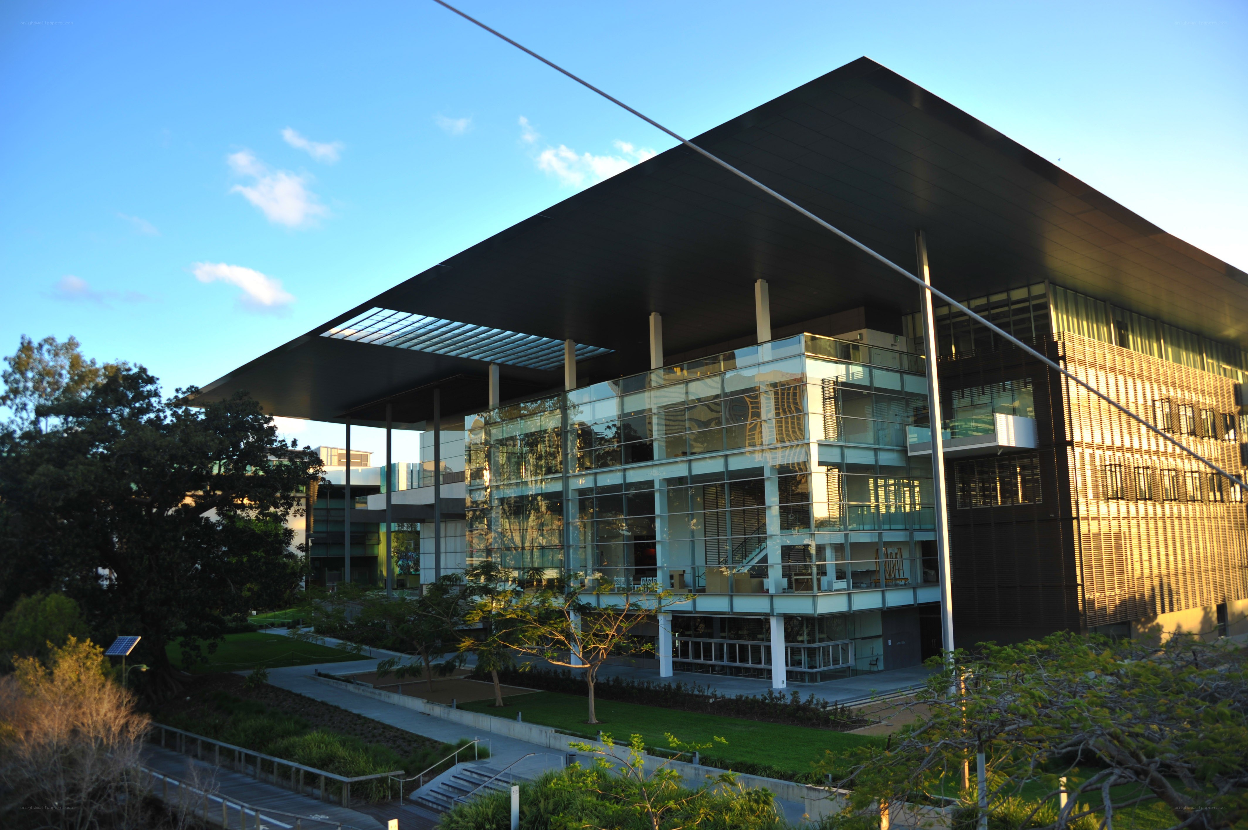 modern glass building at sunset
