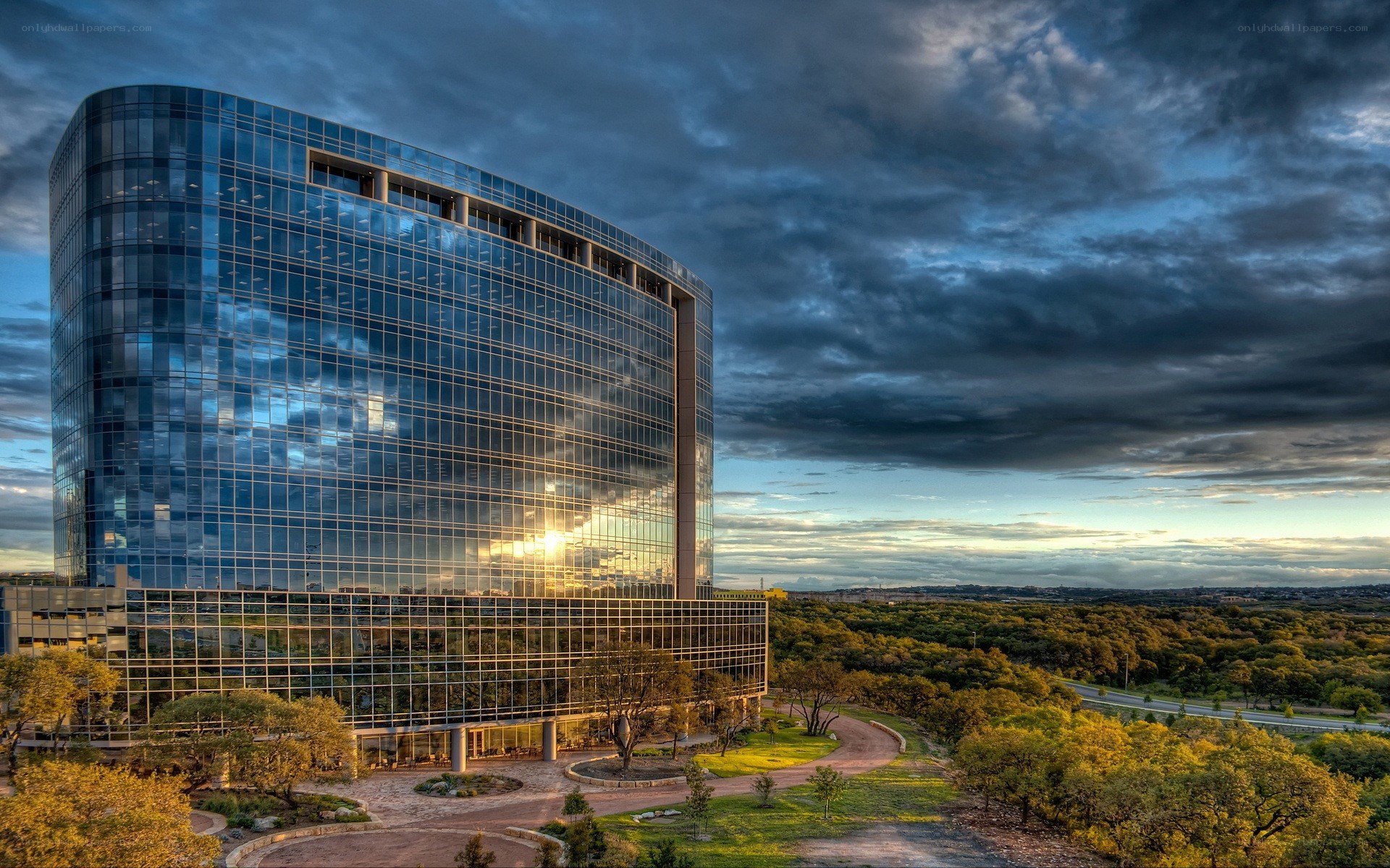 Modern glass building at sunset