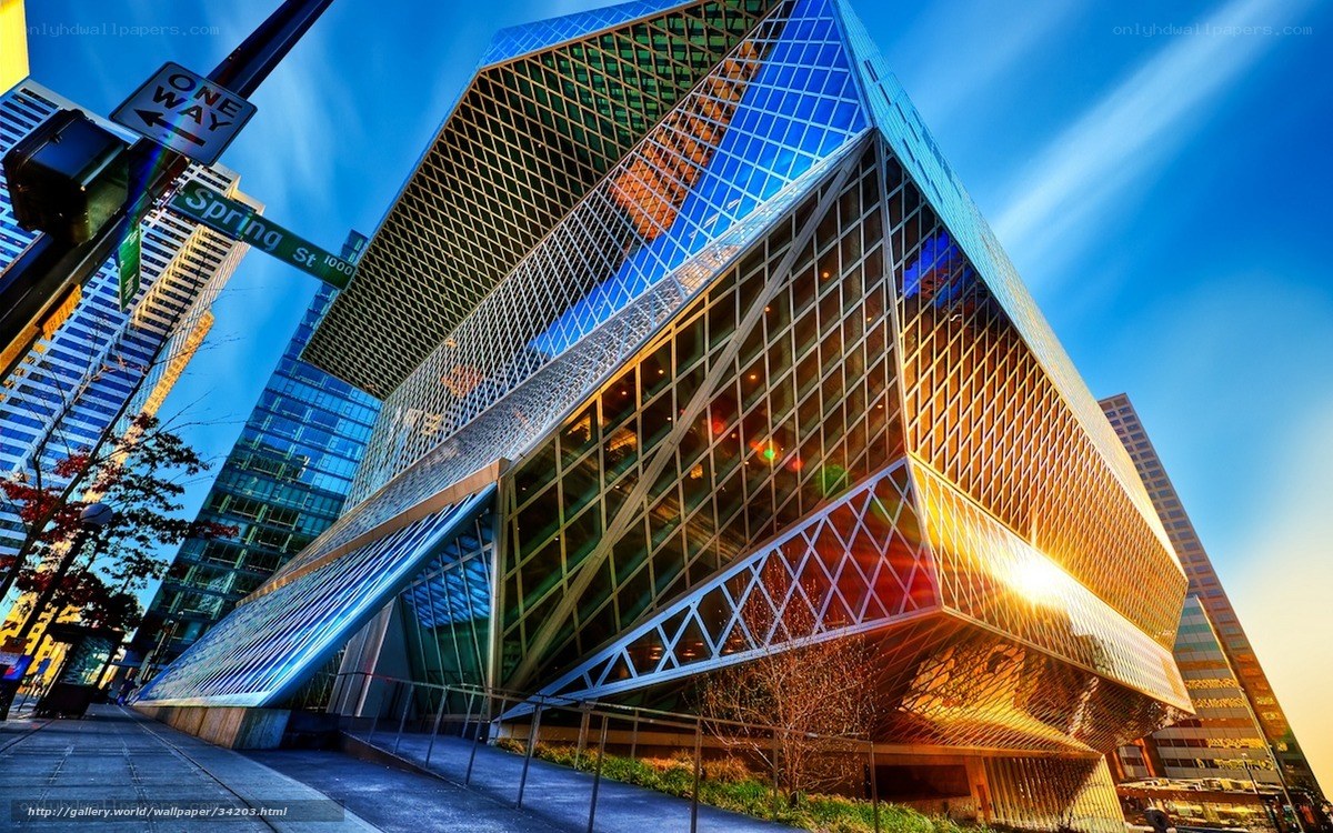 Modern glass building at sunset