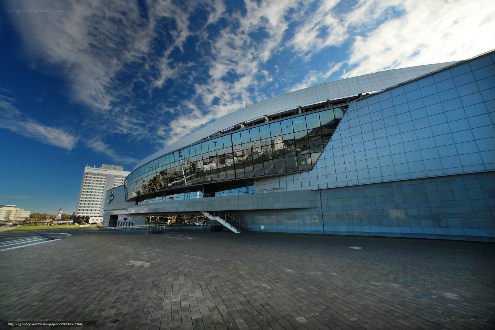 Modern glass building under blue sky