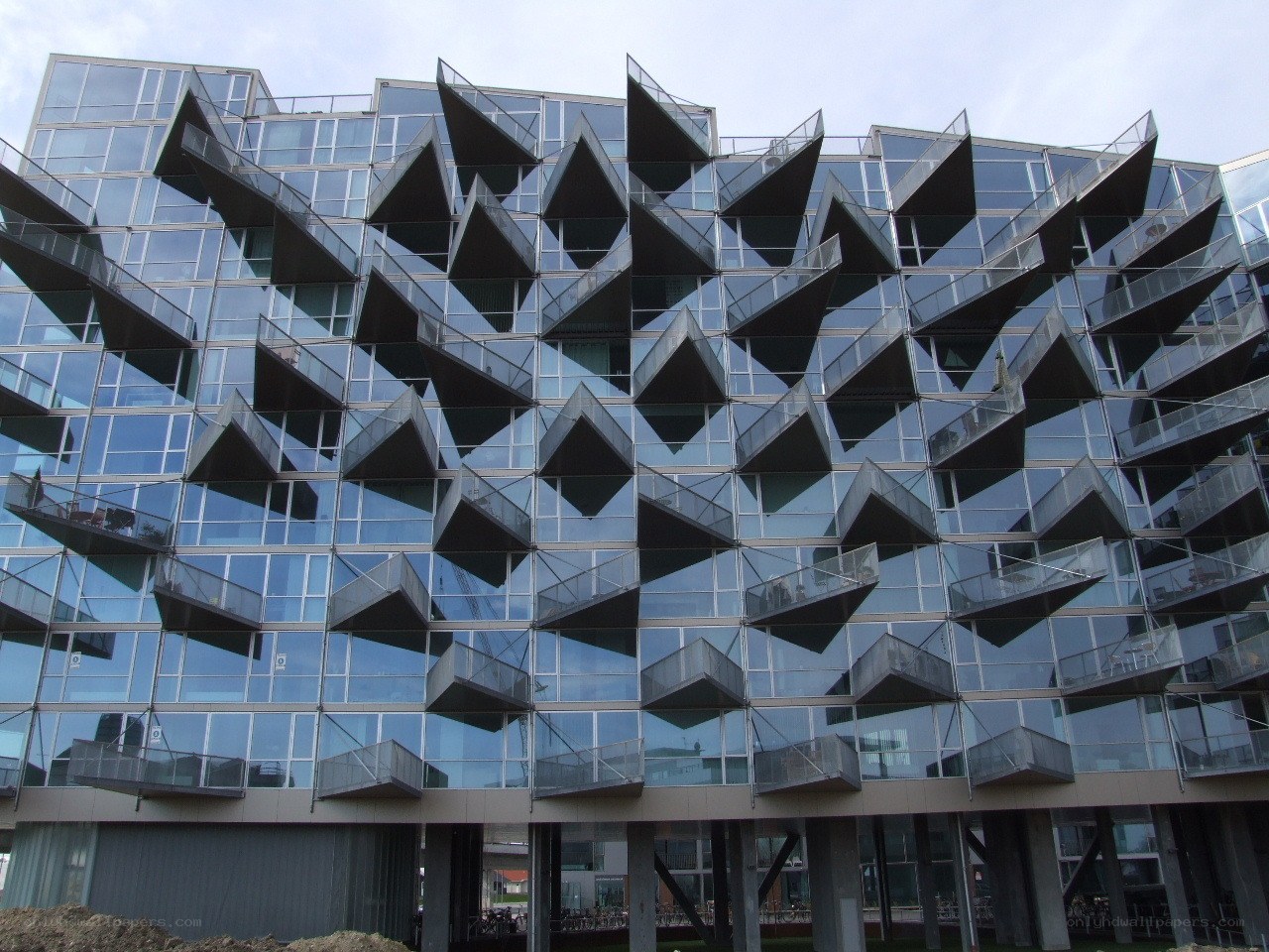 Modern glass building with balconies