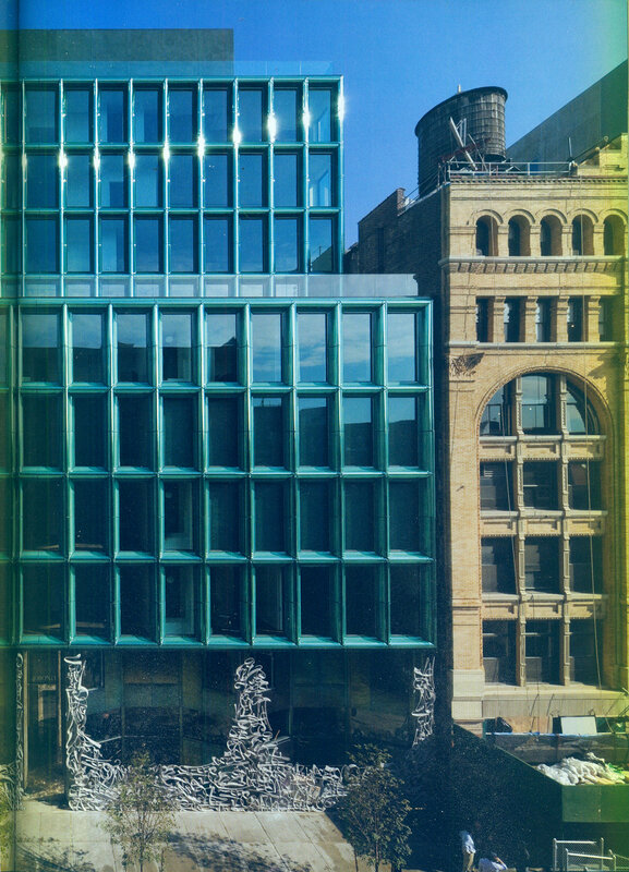 Modern glass building with graffiti art