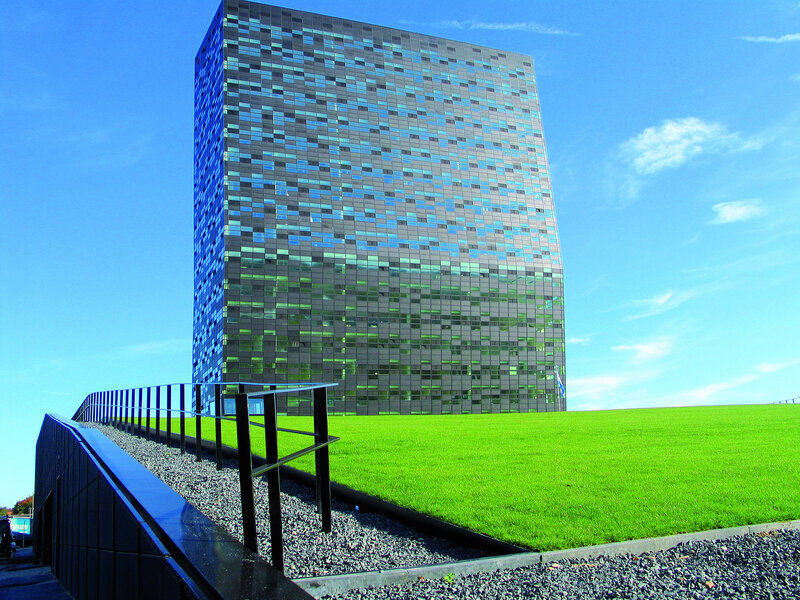 Modern glass building with green roof