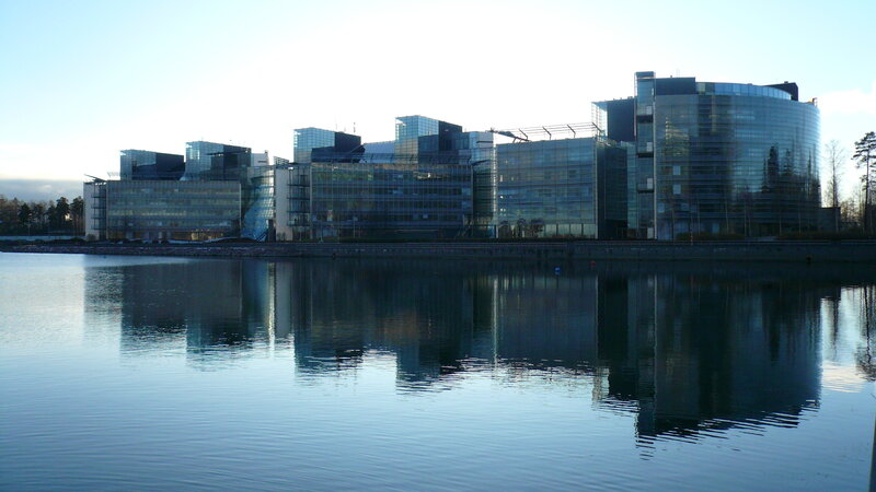 modern glass buildings by water