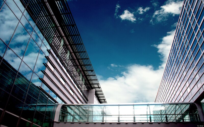 modern glass buildings under blue sky