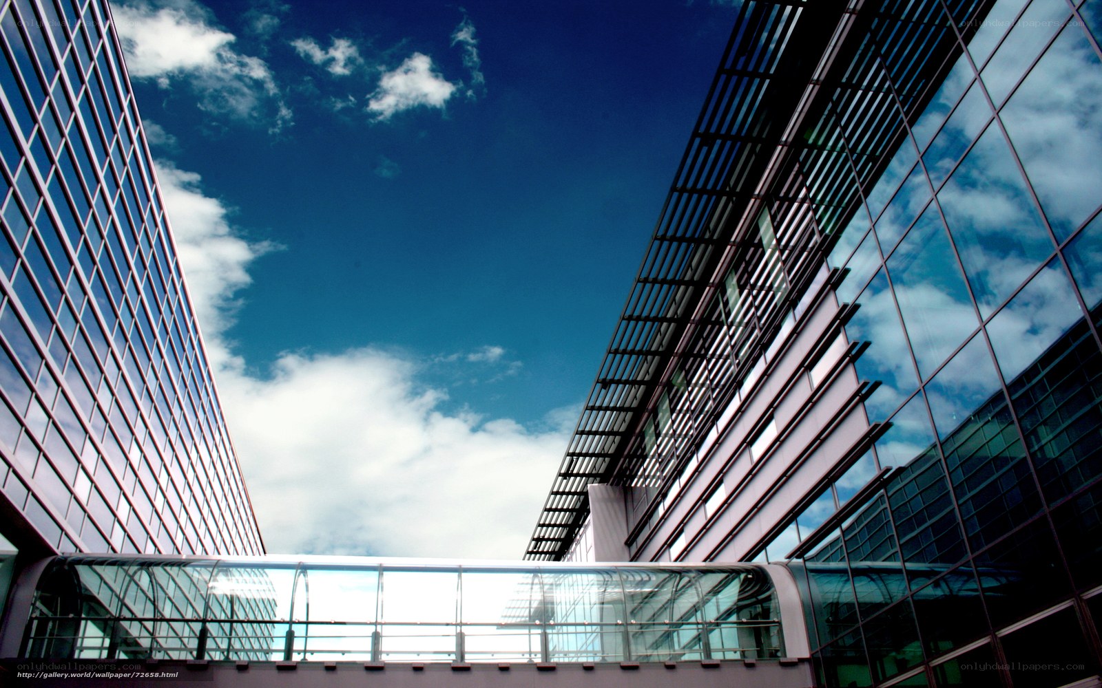 Modern glass buildings under blue sky