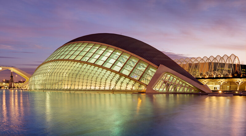 Modern glass dome building at dusk