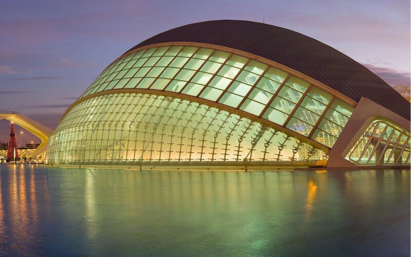 Modern glass dome building at dusk
