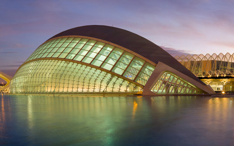 Modern glass dome building at dusk