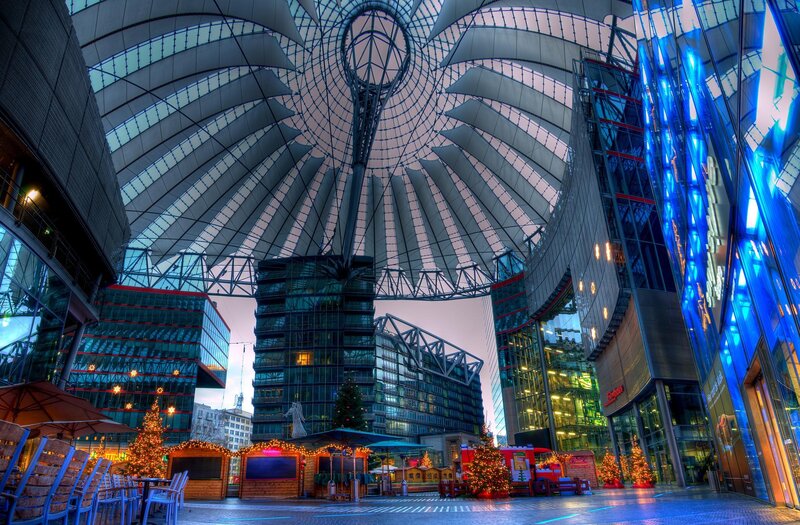 Modern glass dome with Christmas market