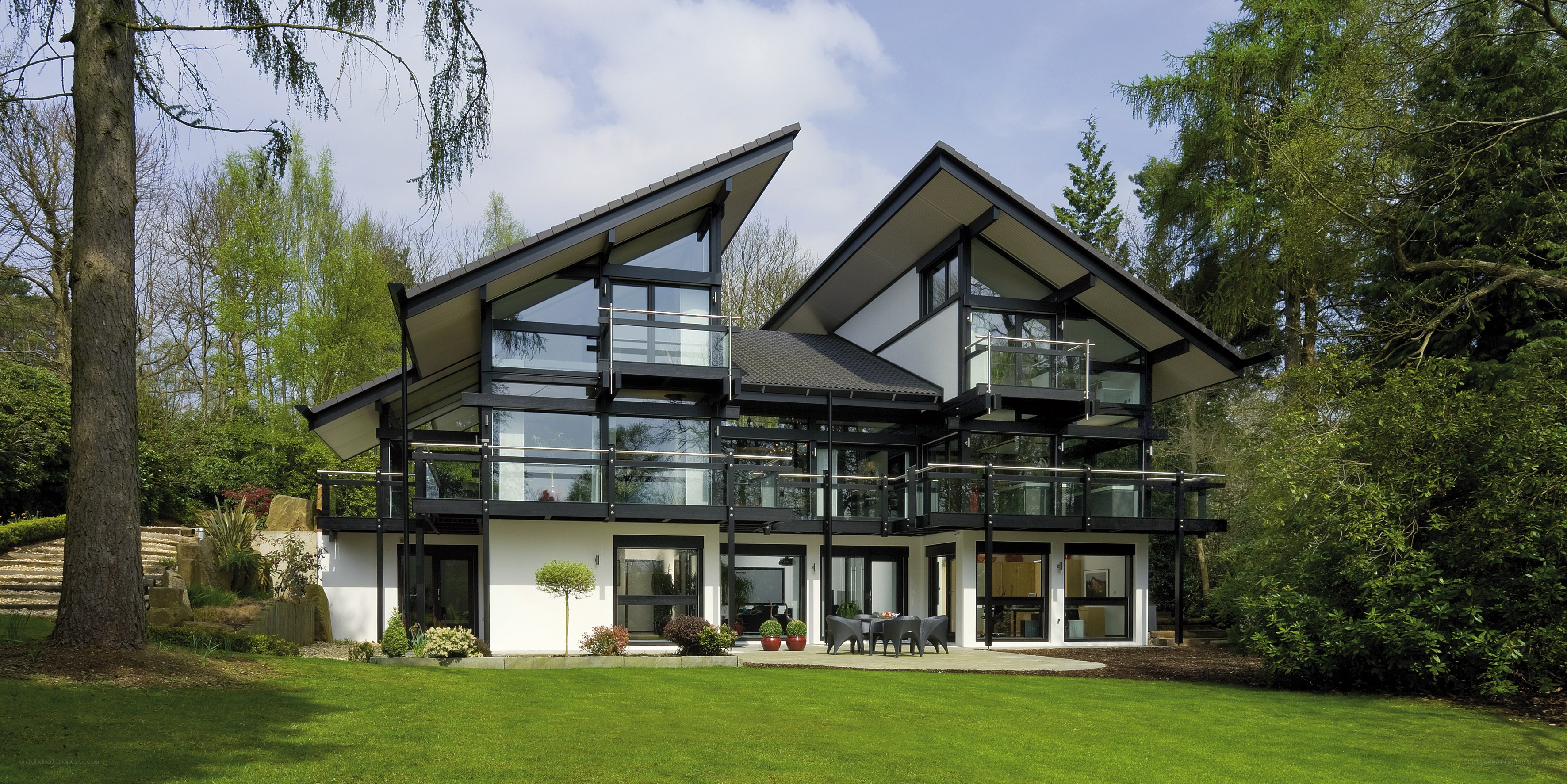 Modern glass house in forest