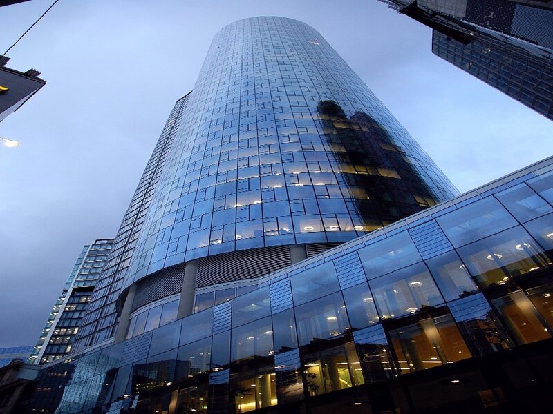 modern glass skyscraper at dusk