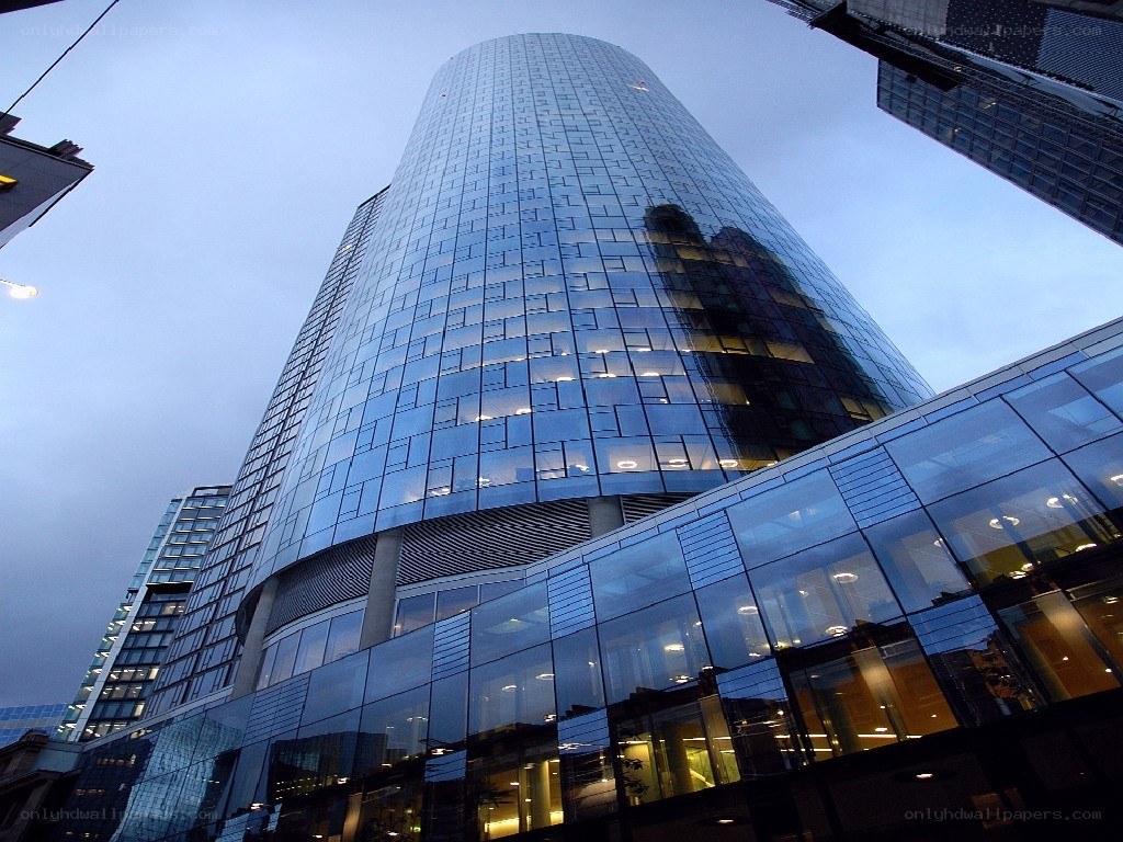 modern glass skyscraper at dusk