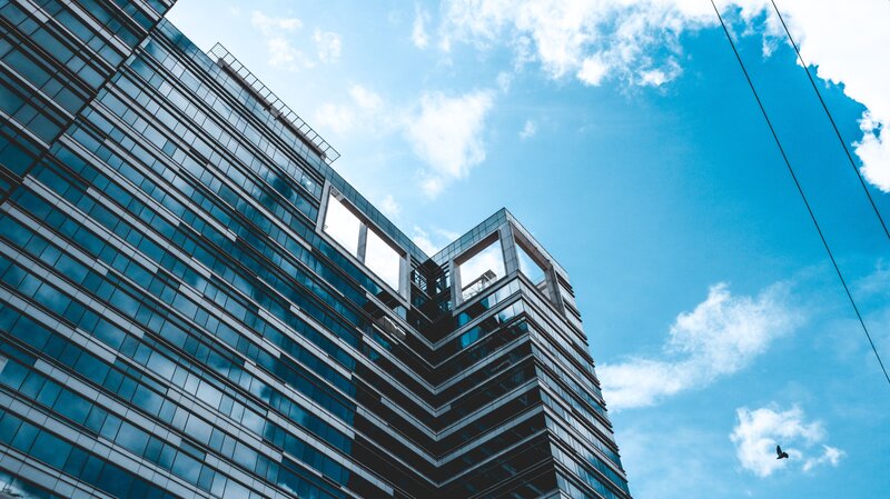 Modern Glass Skyscraper — Blue, Dramatic, Afternoon, Photograph, Blue Sky