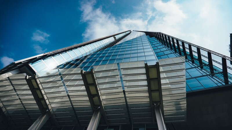Modern Glass Skyscraper — Blue, Dramatic, Afternoon, Photograph, Sky