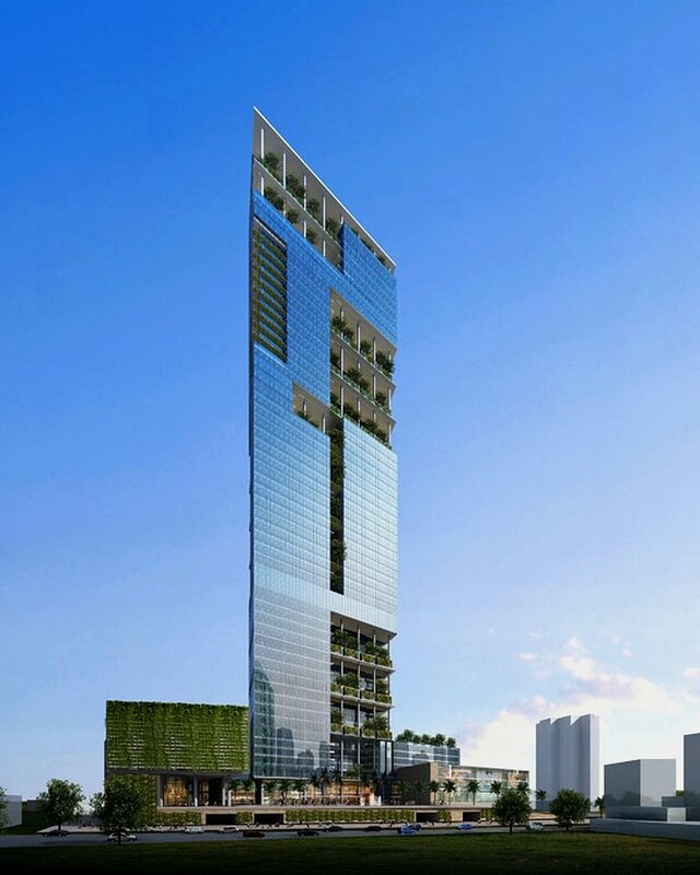 Modern glass skyscraper with green walls