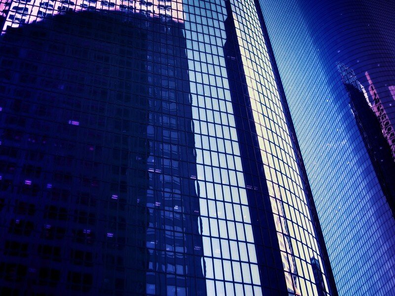 modern glass skyscrapers at night
