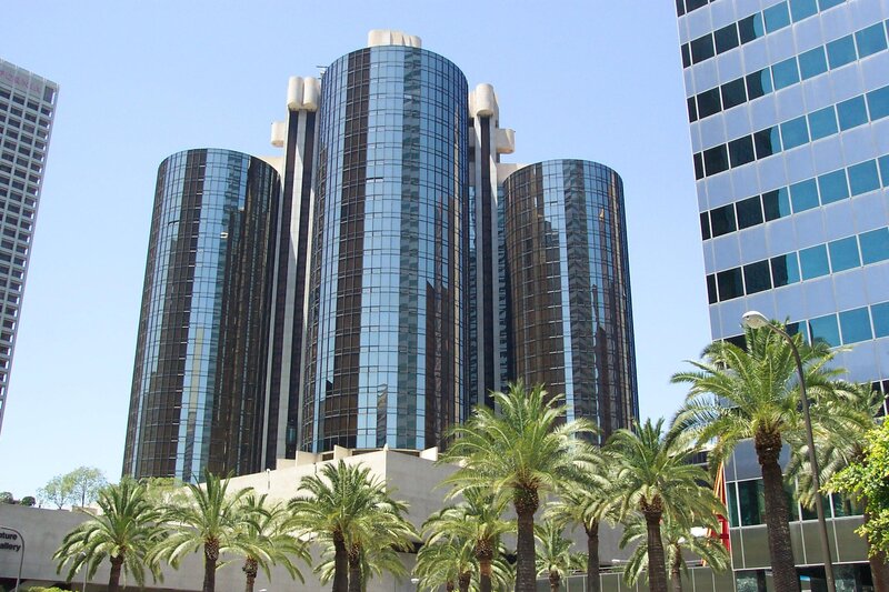 modern glass skyscrapers with palm trees