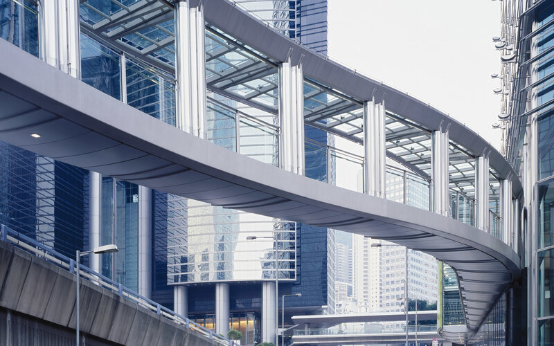 modern glass skywalk in city