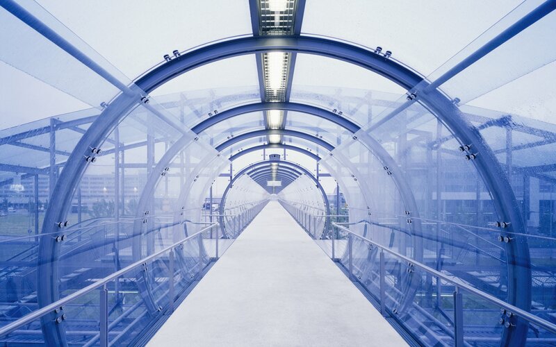 modern glass walkway tunnel