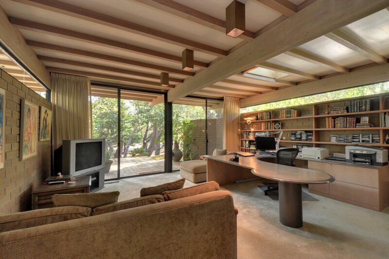 Modern home office with living area