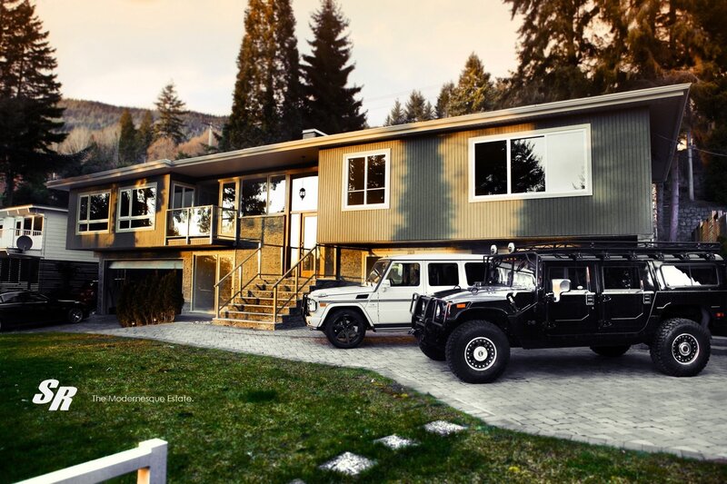Modern home with luxury vehicles
