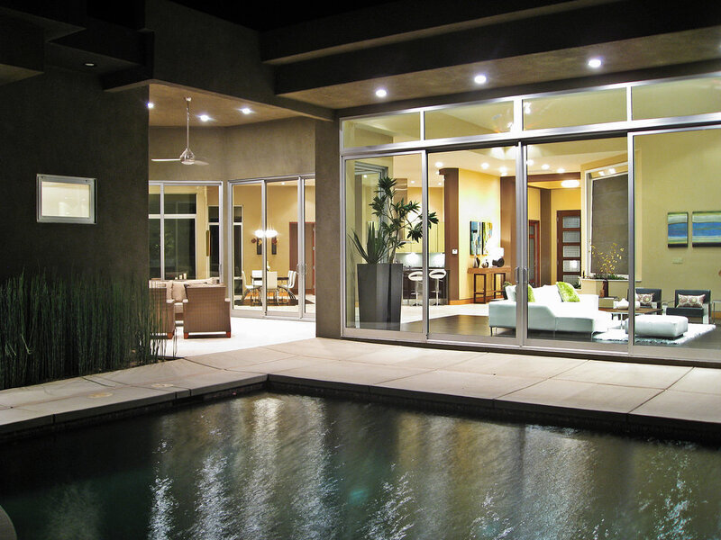 Modern home with pool and glass walls