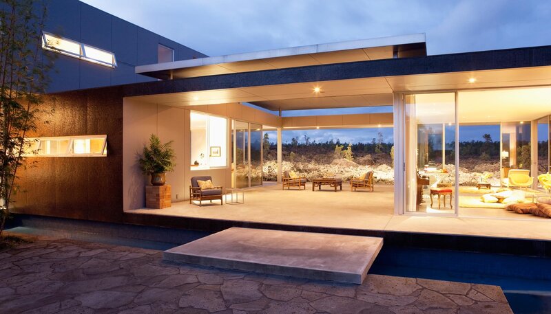 Modern home with pool at dusk