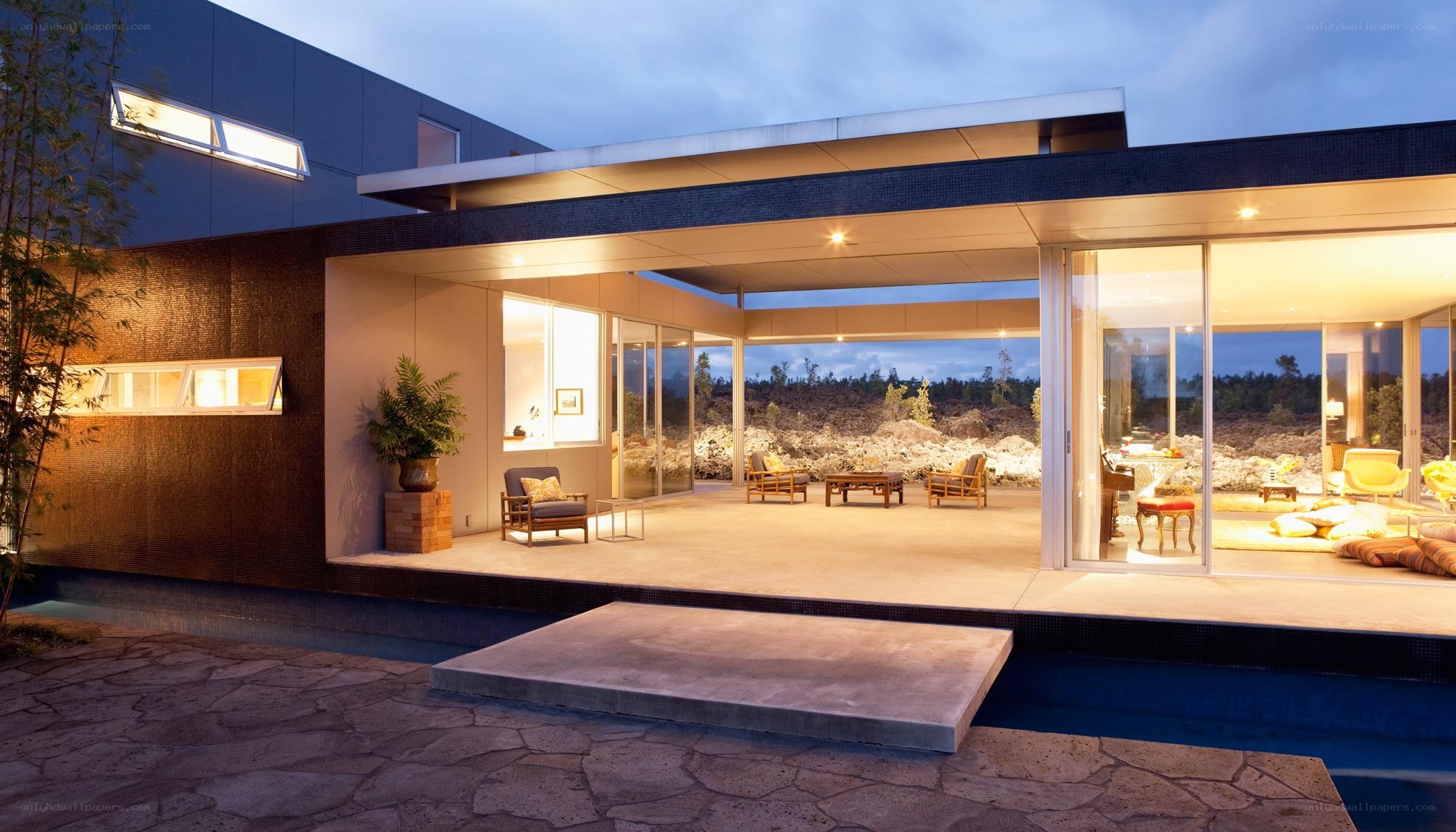 Modern home with pool at dusk