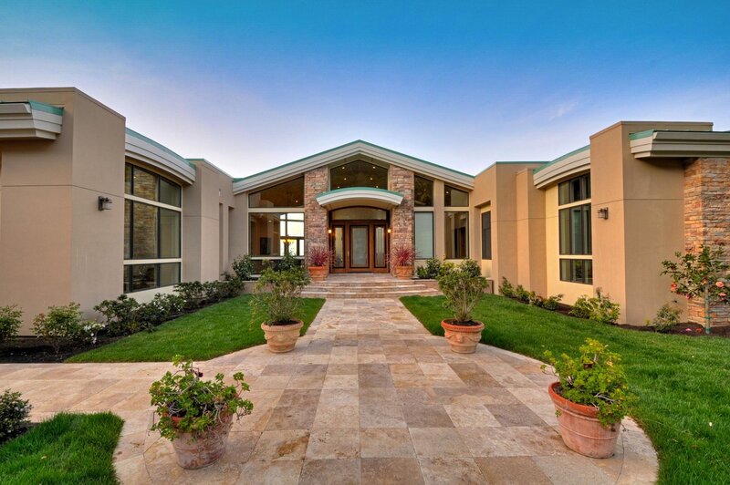 modern home with stone walkway