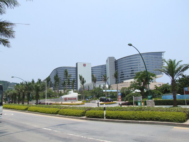 modern hotel complex with palm trees