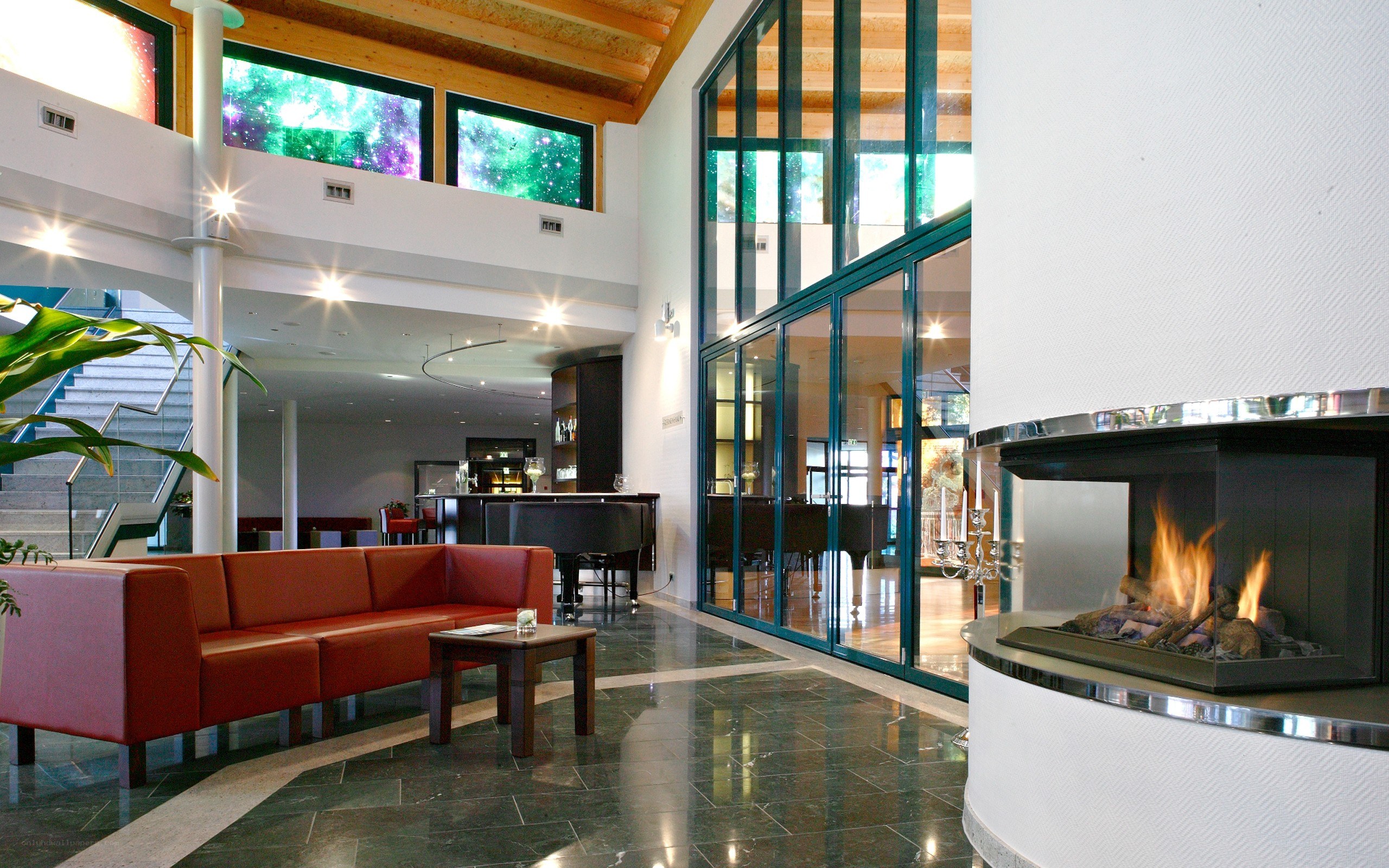 Modern hotel lobby with fireplace