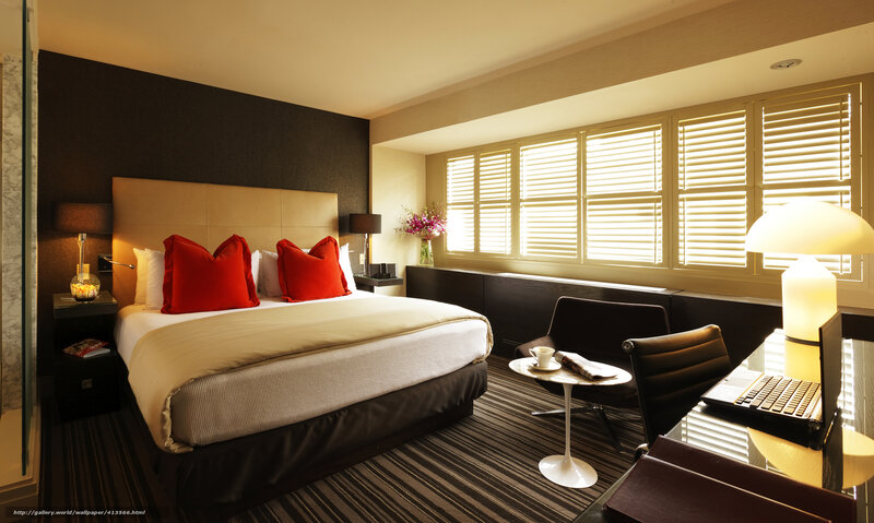 Modern hotel room with red accents