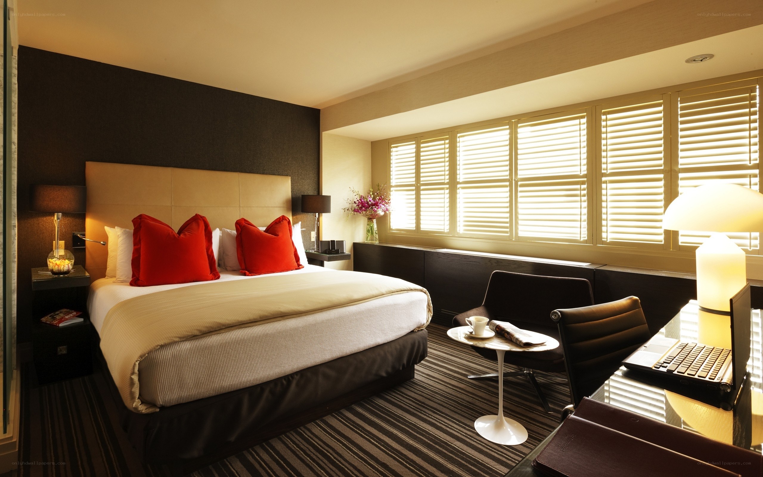 Modern hotel room with red pillows