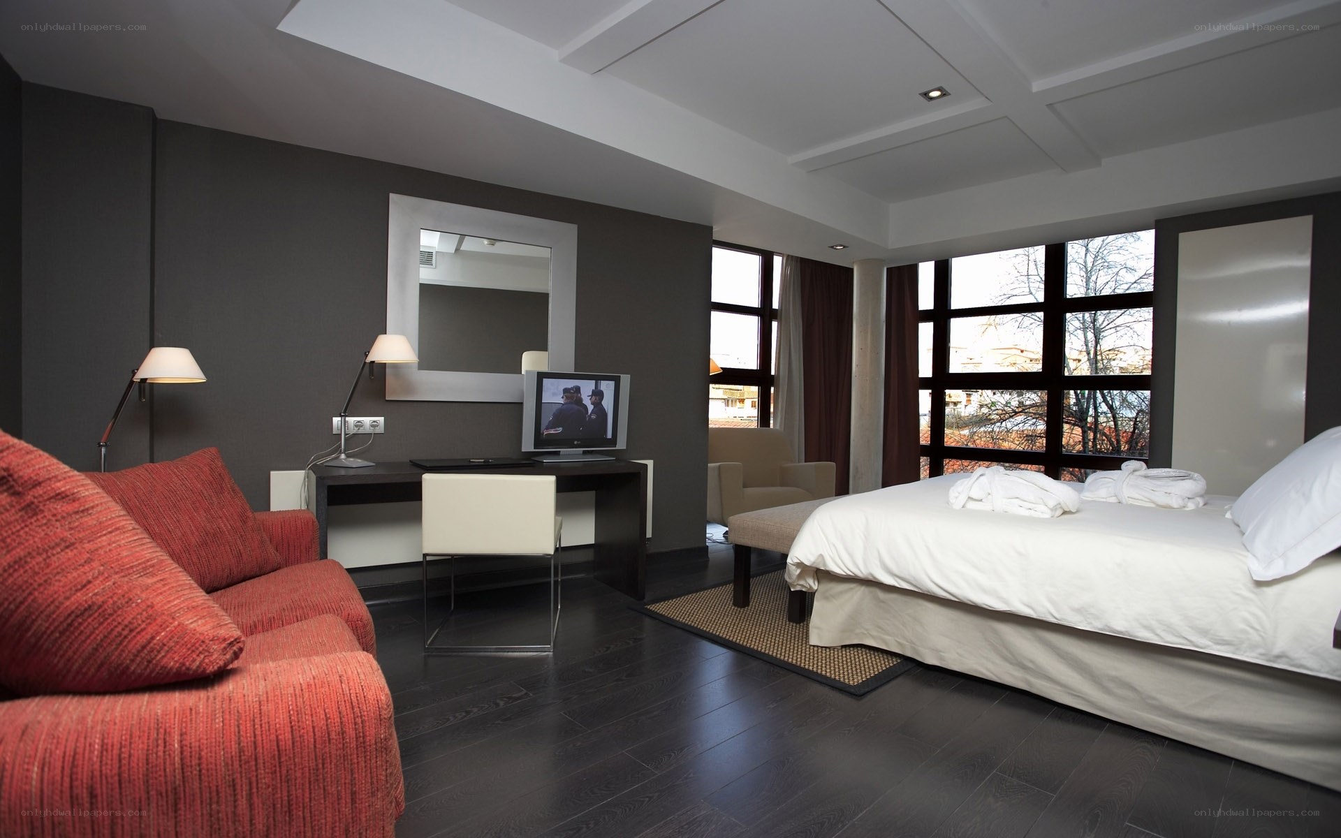 Modern hotel room with red sofa