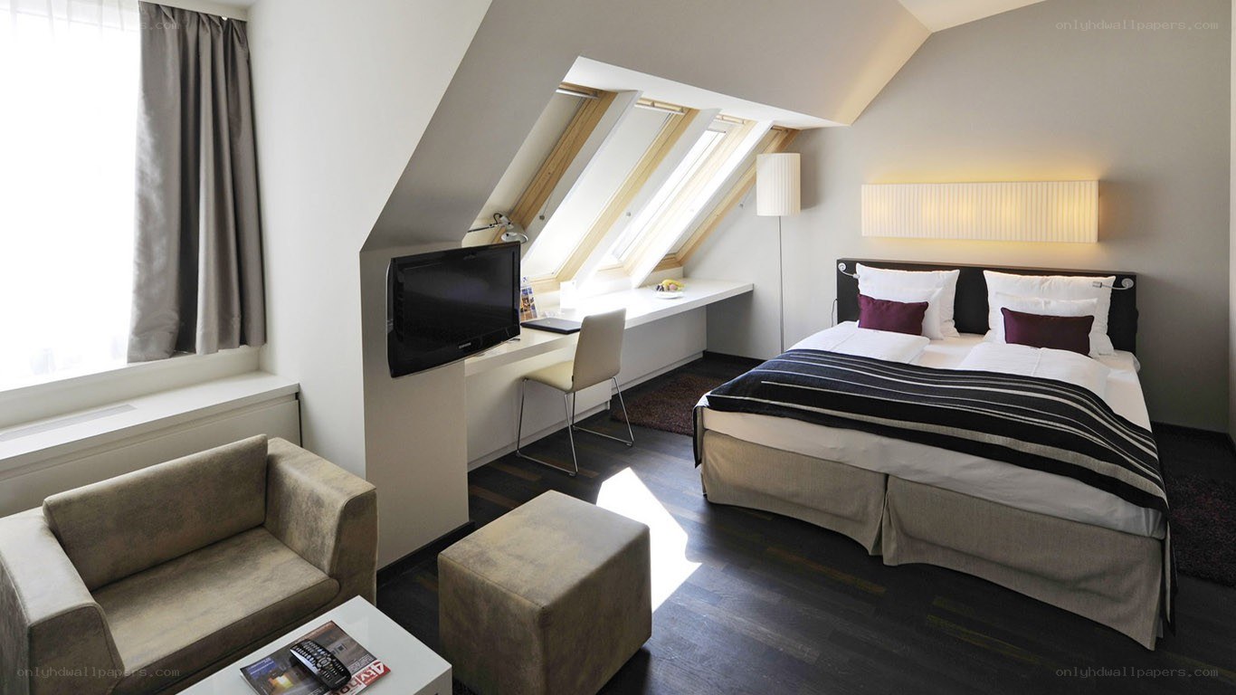 Modern hotel room with sloped ceiling