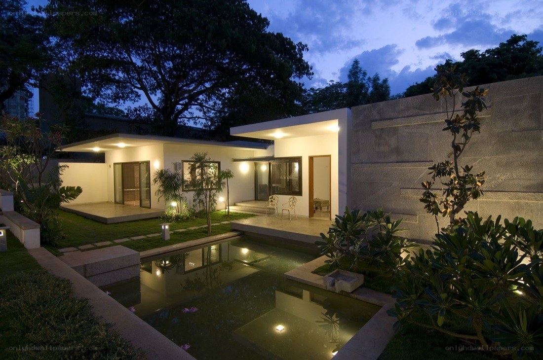 Modern house at dusk with pool