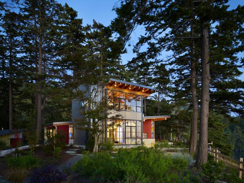 Modern house in forest at dusk