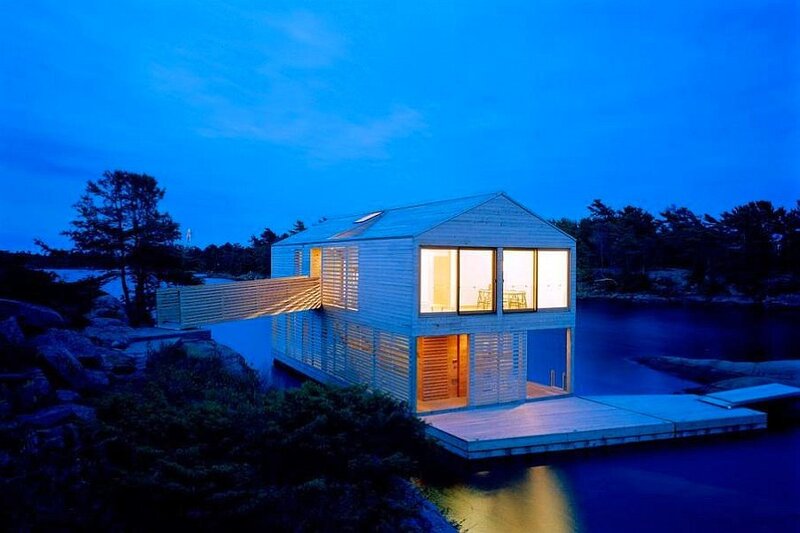Modern house on water at dusk